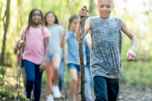 istock Kids walking in the woods together 1040543802