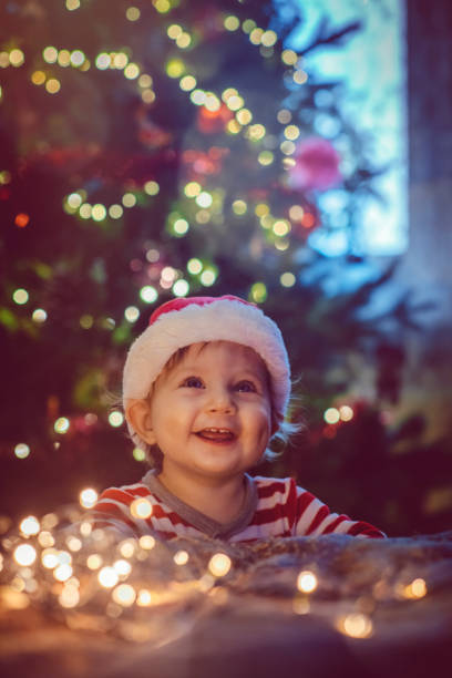 istock Cute boy indoors near Christmas tree 1040563036