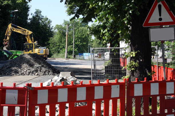 istock road under construction with signal lamps and construction fence 1040567200