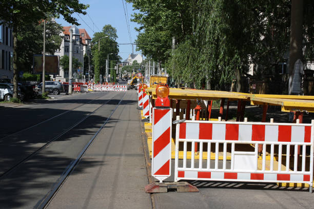 istock road under construction with signal lamps and construction fence 1040567396