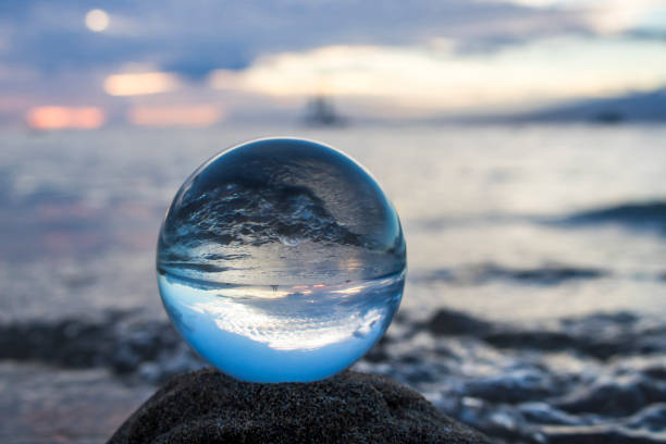istock Seascape with onrushing Surf Captured in Glass Ball 1040578132
