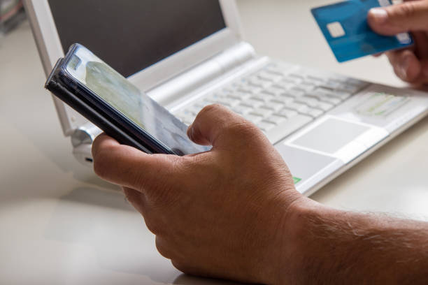 istock Notebook with hand and credit card 1040579154