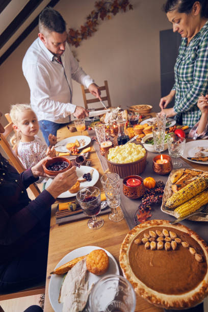 istock Family Having Traditional Holiday Stuffed Turkey Dinner 1040584790