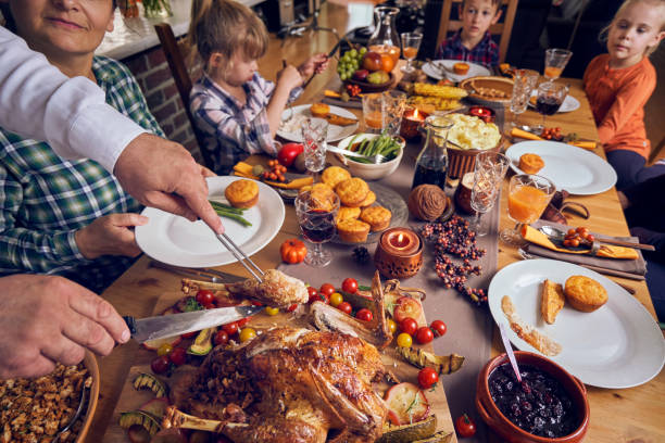istock Family Having Traditional Holiday Stuffed Turkey Dinner 1040584804