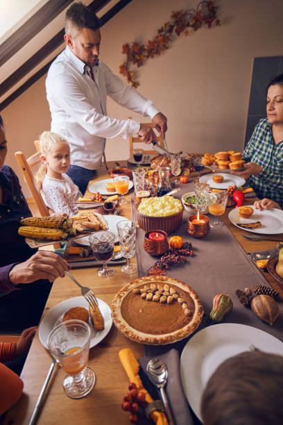 istock Family Having Traditional Holiday Stuffed Turkey Dinner 1040584886