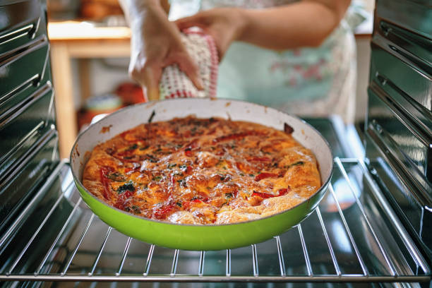 istock Preparing Frittata with Paprika, Spring Onions, Peas, Spinach and Parmesan 1040584926