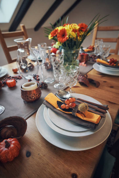 istock Decorated Table for Thanksgiving Dinner with Candles, Pumpkins, Leafs and Nuts 1040586064