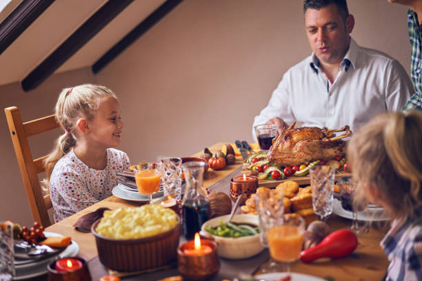 istock Family Having Traditional Holiday Stuffed Turkey Dinner 1040586072
