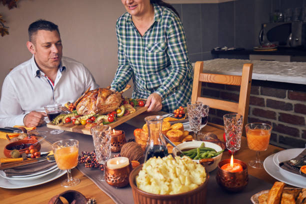 istock Family Having Traditional Holiday Stuffed Turkey Dinner 1040586088