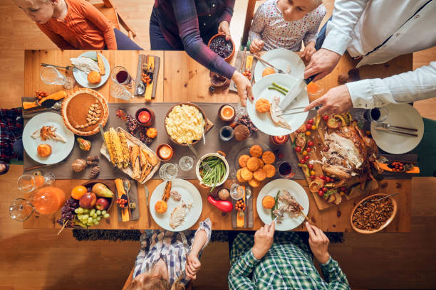 istock Family Having Traditional Holiday Stuffed Turkey Dinner 1040586222