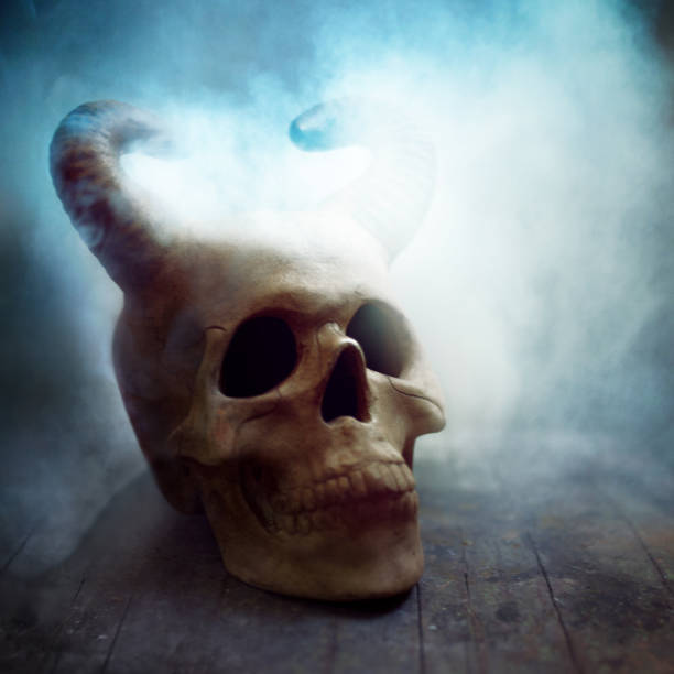 istock horned human skull in the fog. Halloween theme, copy space 1040586390