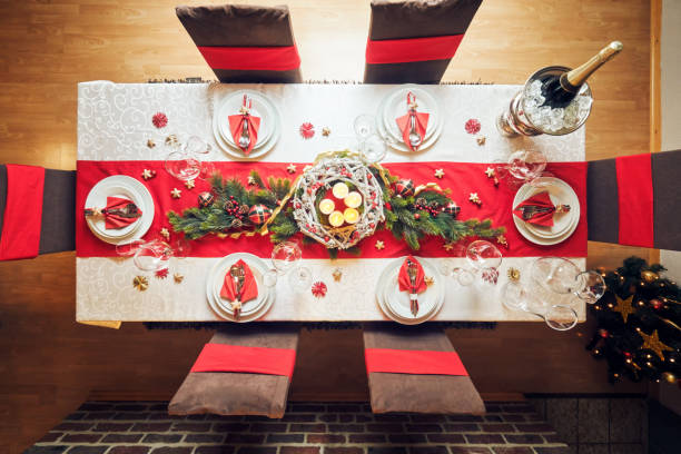 istock Decorated Table for Christmas Dinner with Candles and Christmas Ornaments 1040590526