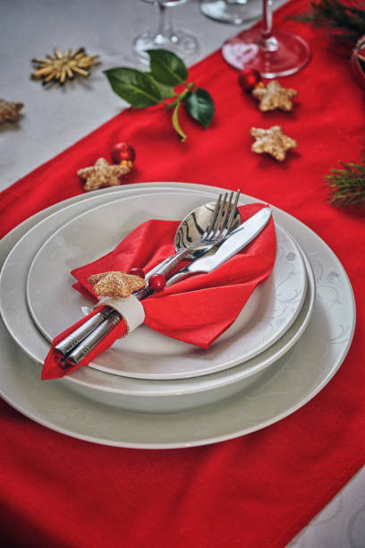 istock Decorated Table for Christmas Dinner with Candles and Christmas Ornaments 1040591320