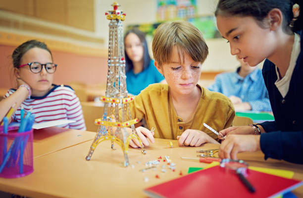 istock School kids are working with metal construction set in the classroom 1040592298