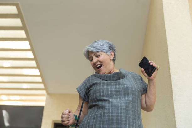 istock Senior Woman Dancing at Home 1040592380
