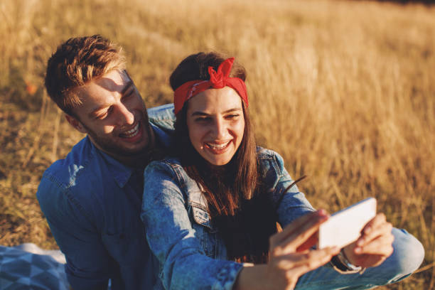 istock Young happy couple doing selfie in the nature 1040593324