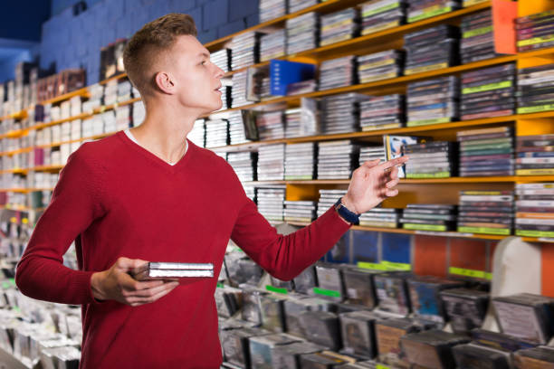istock Young guy looking for interesting movies 1040603872