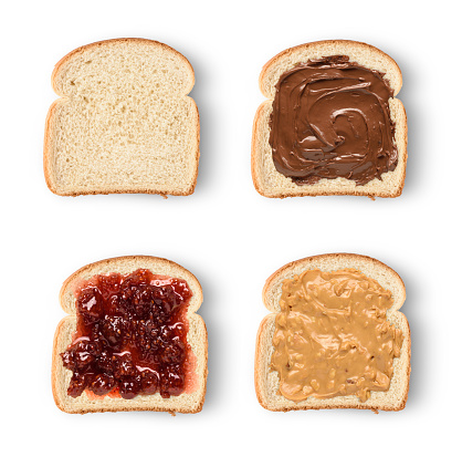 Set of toast bread slices with chocolate spread, peanut butter and jam. Isolated on white