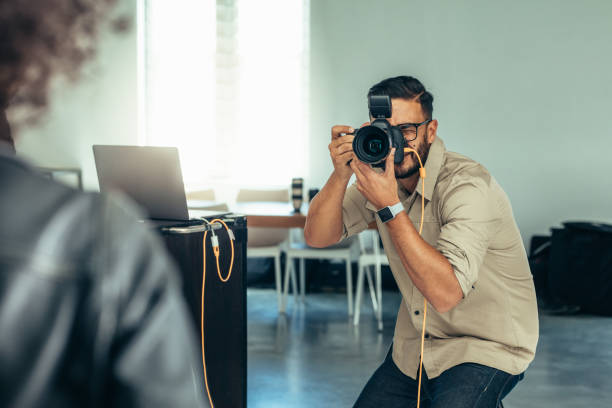 istock Photographer taking photo of a model 1040613324