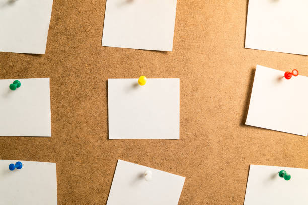 istock nine white stickers for taking notes on a cardboard background 1040614456