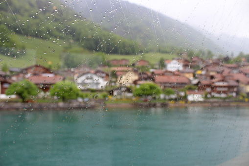 Rain drops on window pane in Lake Thun, Switzerland