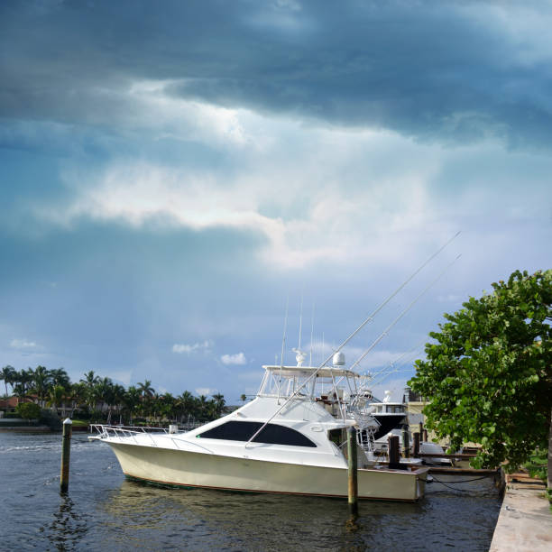 istock close up white private boat moored to a dock at bay over cloudy sky 1040619274