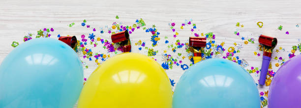 istock Decoration party pattern on white wooden surface, top view. Flat lay, from above. Closeup. 1040620454