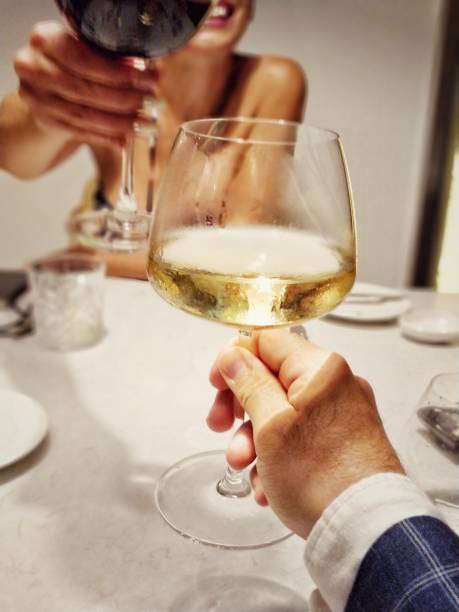 istock Couple cheering with Two wine glasses at dinner 1040626182