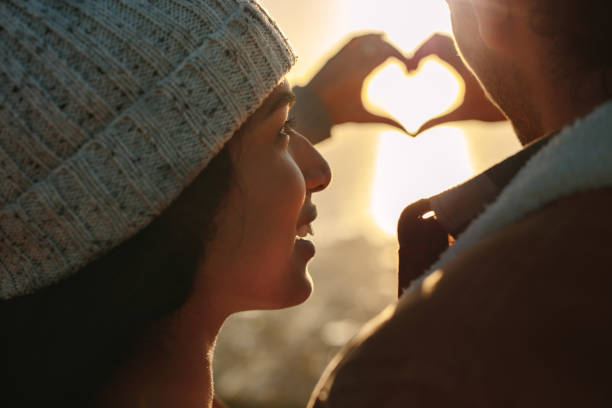 istock Couple in love gesturing a heart 1040629666