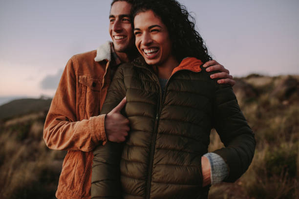 istock Smiling couple enjoying the view from mountain 1040629812