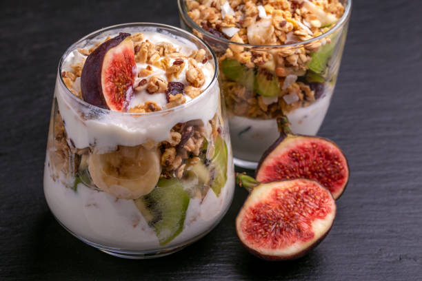 istock Granola with yogurt, bananas and figs. Copy space 1040632342