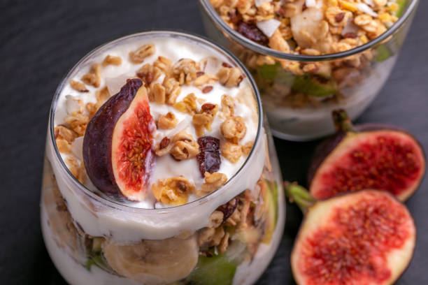 istock Granola with yogurt, bananas and figs. Copy space 1040632354