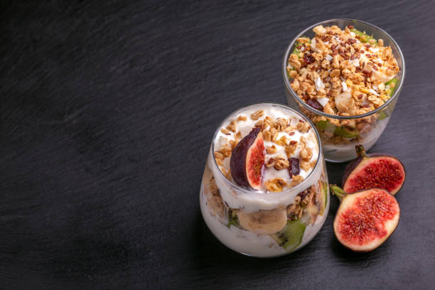 istock Granola with yogurt, bananas and figs. Copy space 1040632416