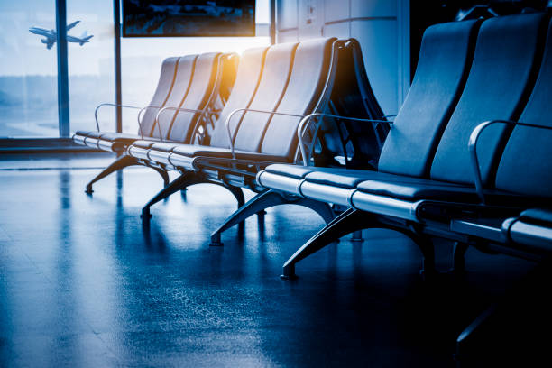 istock empty chairs in airport,blue toned 1040638184
