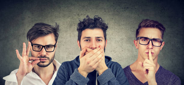 istock Three secretive men keeping mouth shut. 1040644602