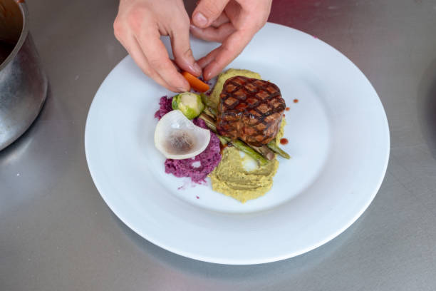 istock Chef in hotel or restaurant kitchen cooking only hands 1040645210