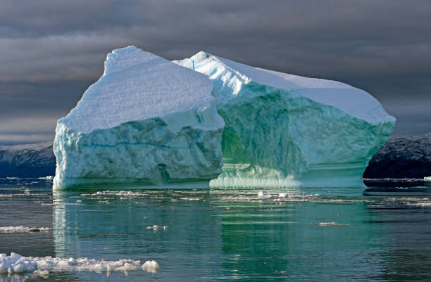istock Large Icebergs in Clouds and Sun 1040647754