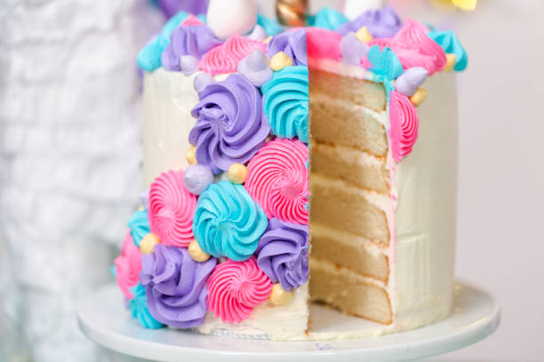 istock Sliced multilayer unicorn cake on cake stand 1040652038