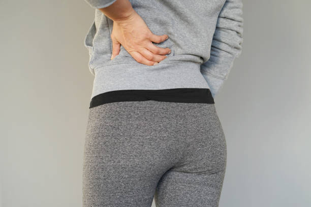 istock Woman, pain at lower back. 1040652062