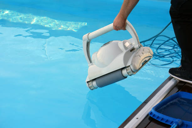 istock Hotel staff worker cleaning the pool 1040653678
