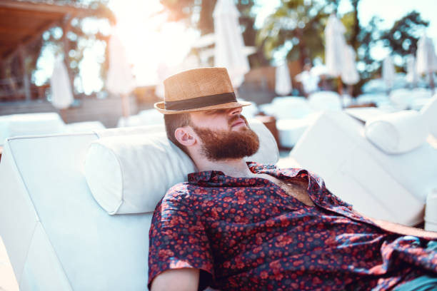 istock Hangover Men Taking Nap At The Beach 1040673286