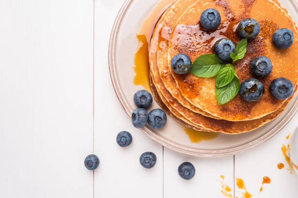 istock Stack of pancakes with fresh blueberry and caramel syrup 1040675240