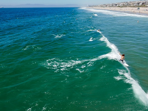 Manhattan Beach, Southern California, shoreline with surfers in water