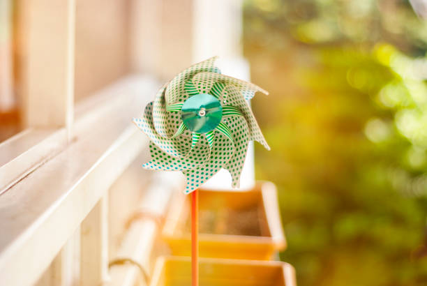 Pinwheel on sunset with flare
