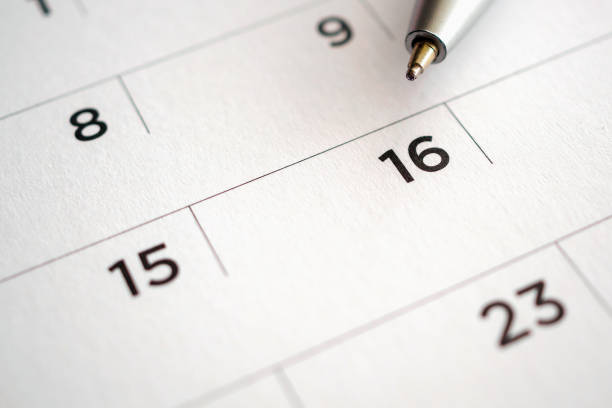 istock Calendar page with pen point at 16th date 1040705002
