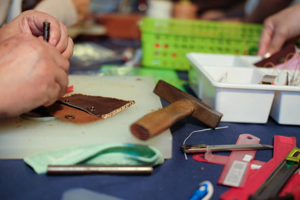 istock craftsman making leather bag. handmade DIY handicraft 1040705050