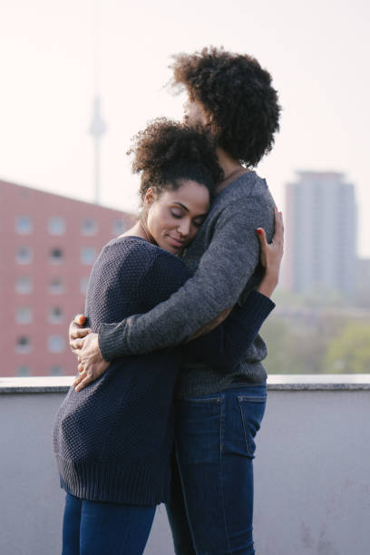 istock Young couple on a rooftop terrace at sunset 1040706280