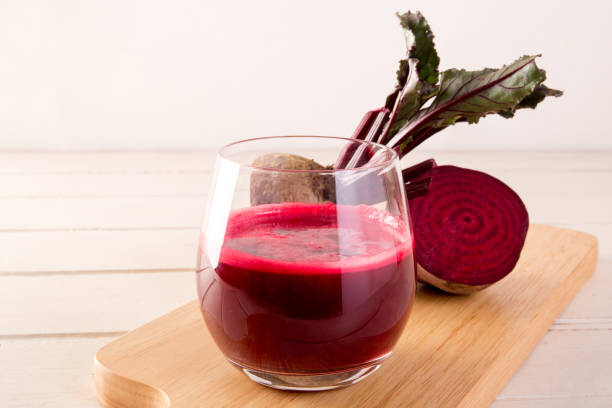 istock Beetroot cold pressed juice in glass, Healthy raw vegetable and fruit drink for detox. 1040706420