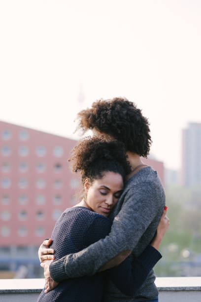 istock Young couple on a rooftop terrace at sunset 1040706848