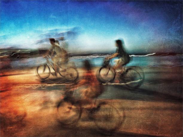 istock Blurred motion view of three cyclists on the street at twilight 1040729304